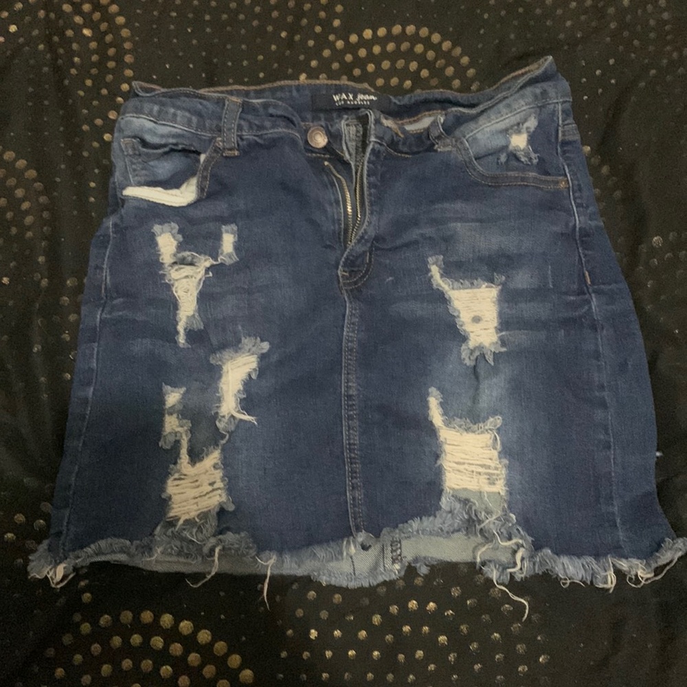 Im selling a wax denim jean skirt with rips in it